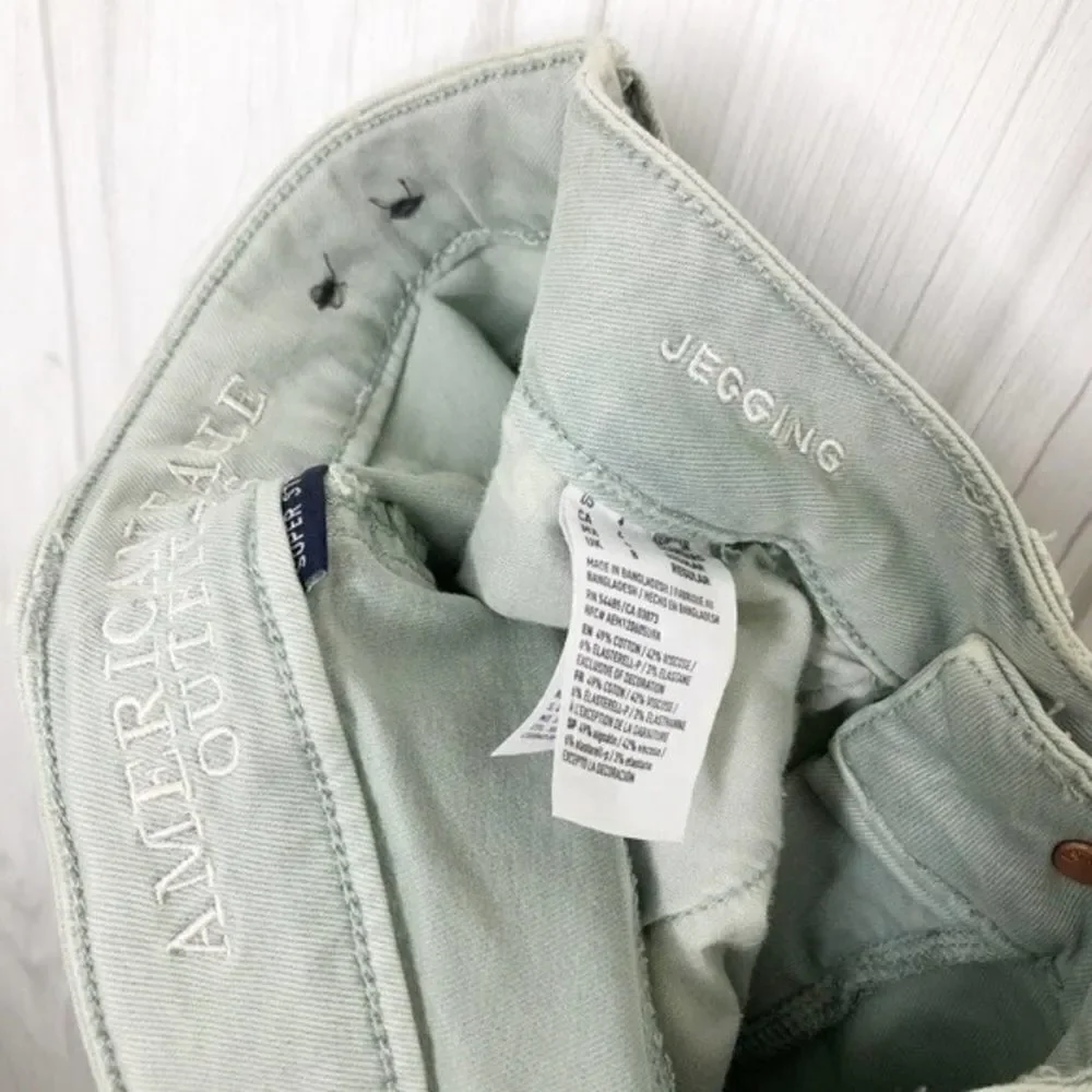 AMERICAN EAGLE Seafoam Destroyed Skinny Jeans